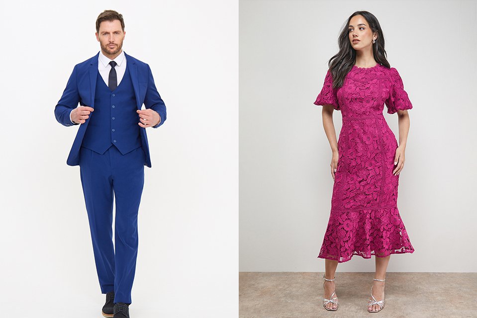 A man in a blue suit and woman in a peplum dress.